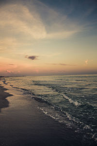 Scenic view of calm sea at sunset