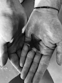 Close-up of man holding hands