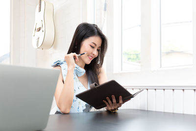 Young woman using mobile phone