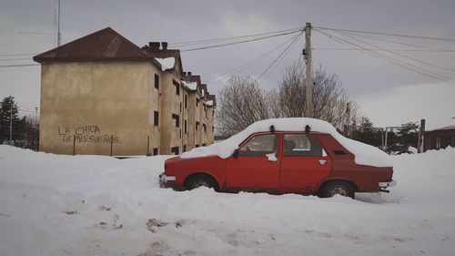 Snow covered car and field