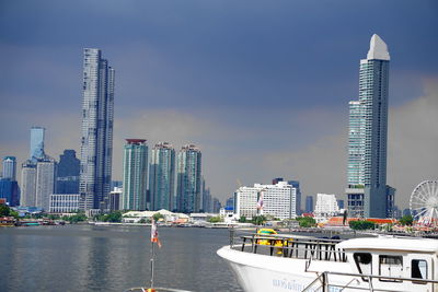 Panoramic view of modern buildings against sky in city