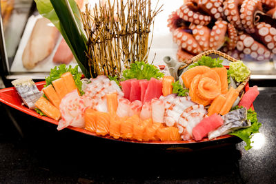 Close-up of sashimi served in tray on table