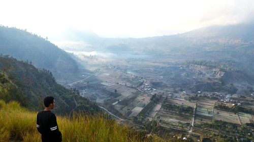 Enjoying the view of pinggan village under mount matur hills in the morning