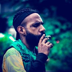 Portrait of young man smoking