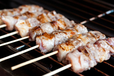 Close-up of meat on barbecue grill