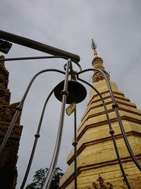 Low angle view of street light against building