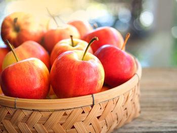 Close-up of apples in basket on table