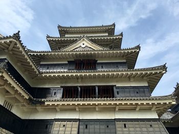 Low angle view of temple building against sky