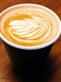 Close-up of cappuccino on table