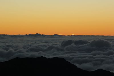 Scenic view of sea against clear sky during sunset