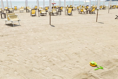 Empty chairs on beach