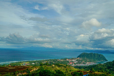 Scenic view of sea and buildings against sky