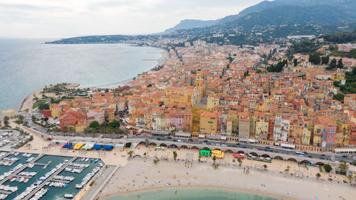 High angle view of city by sea