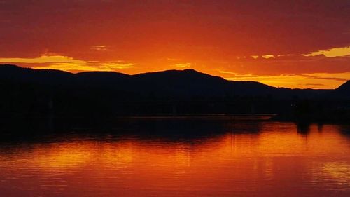 Scenic view of lake at sunset