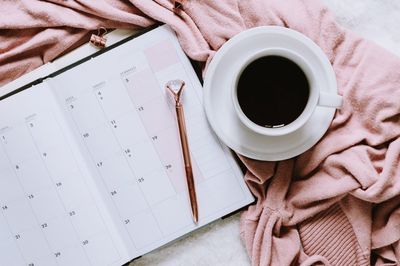 High angle view of coffee cup on table