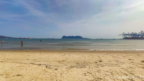 Scenic view of beach against sky