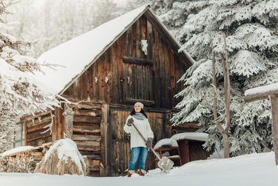 Portrait of man standing in barn