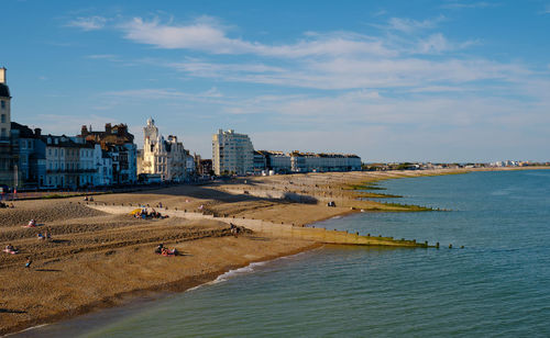 View along eastbourne shingle beach towards sovereign harbour on a summers evening.