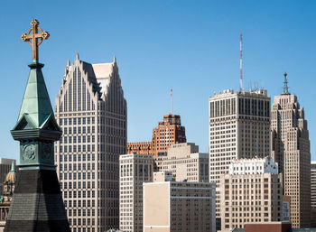 Low angle view of modern buildings against clear sky in city