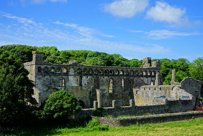 Old ruin building against cloudy sky