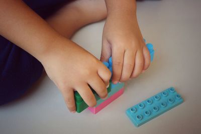 Close-up of baby hand holding toy