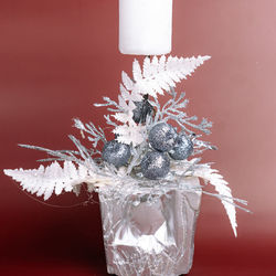 Close-up of frozen glass against white background