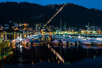 Boats in harbor at night