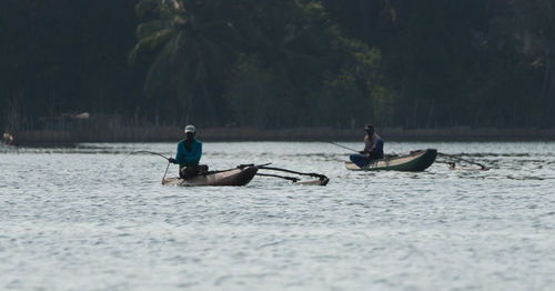 People on boat in river