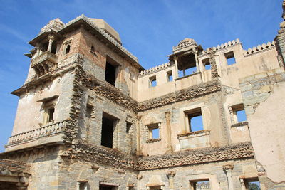 Low angle view of historical building against blue sky