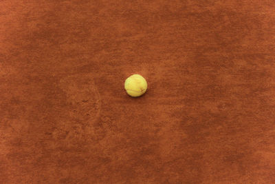 High angle view of yellow ball on floor