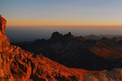 Scenic view of mountains against sky during sunset