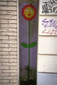 Close-up of plants on brick wall