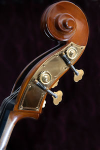 Close-up of guitar against black background