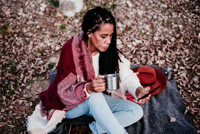 Woman drinking water from coffee