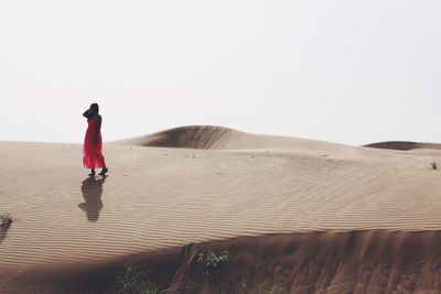 Woman walking in the desert