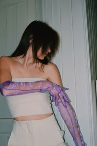 Girl wearing purple gloves