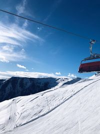 Overhead cable car against sky during winter