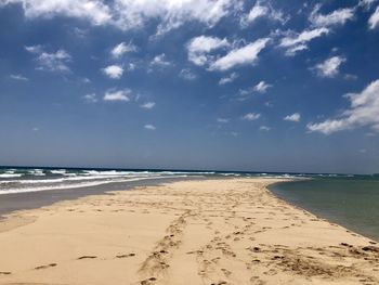 Scenic view of beach against sky