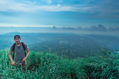 Woman standing on mountain