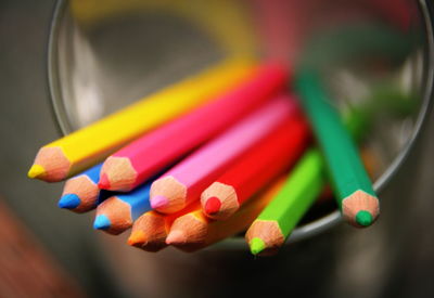 Close-up of multi colored pencils in case