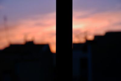 Close-up of silhouette against sky during sunset