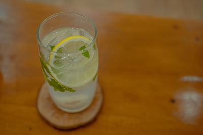 Glass of drink on table