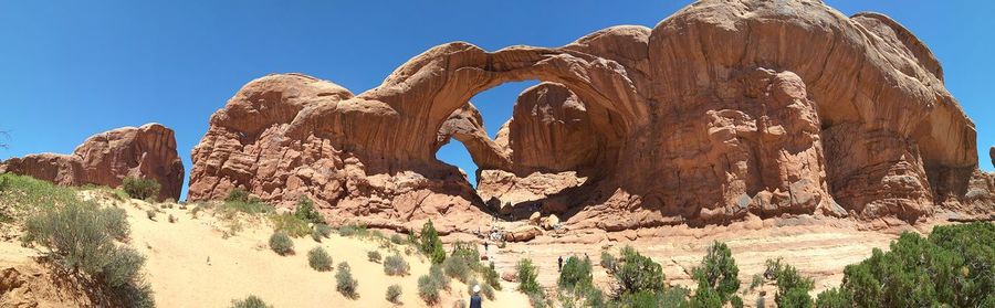 Low angle view of rock formation against sky