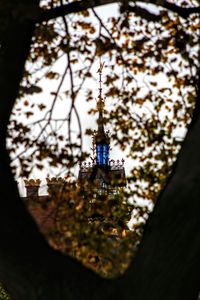 Low angle view of communications tower against sky