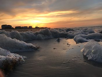 Scenic view of sea against sky at sunset