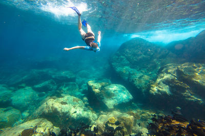 Woman swimming in sea