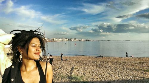 Portrait of woman standing on beach