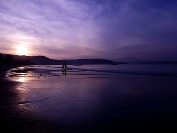 Scenic view of sea against sky at sunset