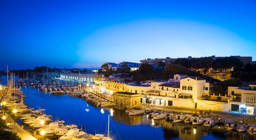 High angle view of illuminated buildings in city at night