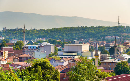 High angle view of townscape and mountains against sky